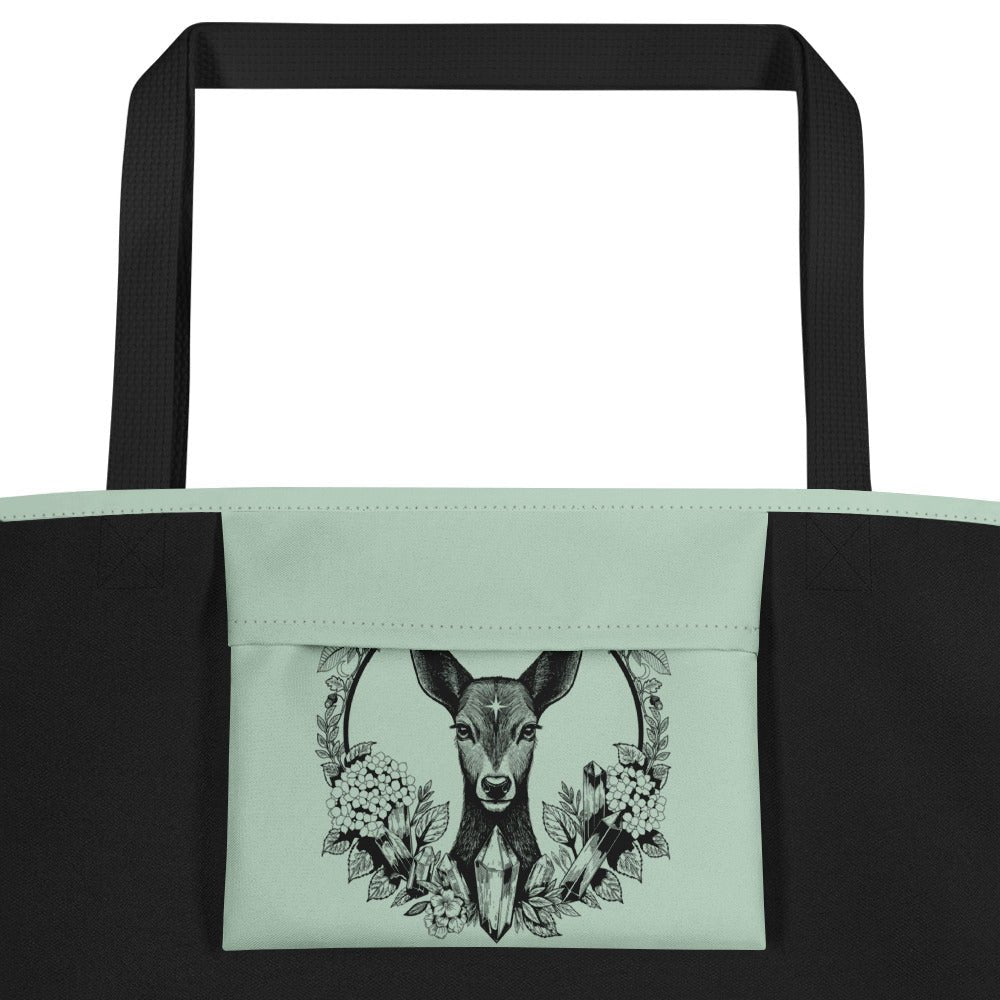 Close-up of Secret of Lir and Eilit tote bag showing intricate hand-drawn deer, dragon, and tree of life illustration by Brittyliz Art