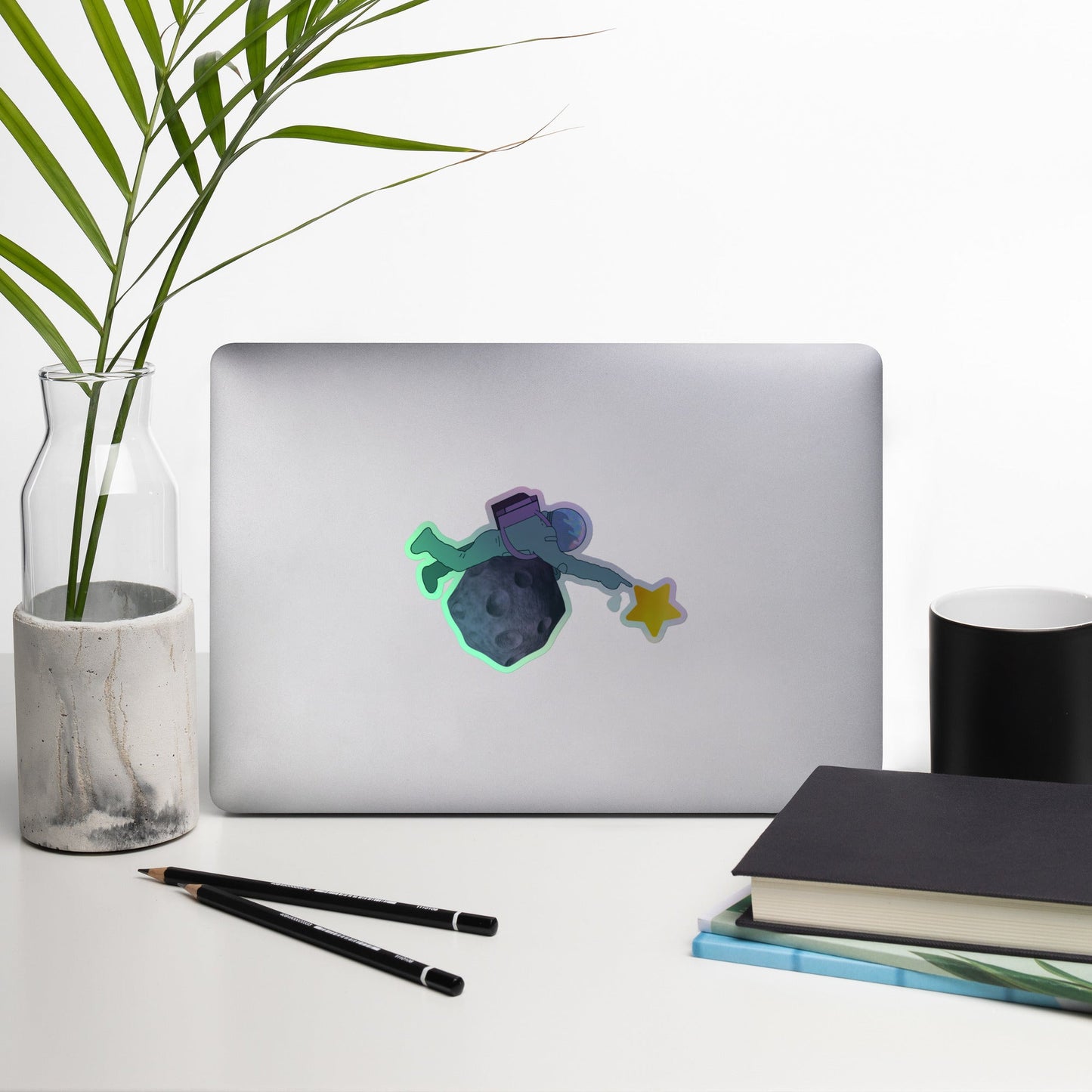 Reach for the Stars holographic vinyl sticker with original hand-drawn space and asteroid art by Brittyliz, showing rainbow shimmer finish