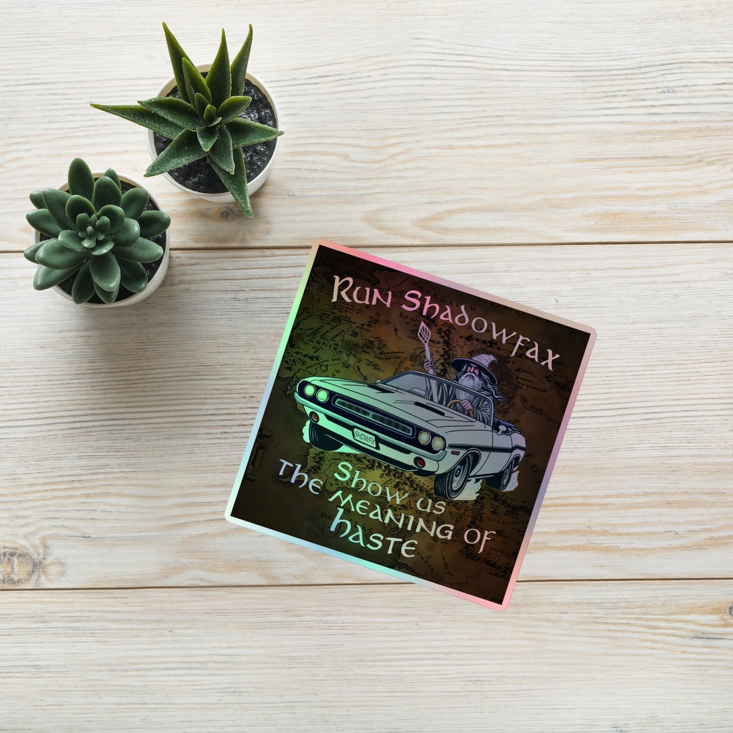 Make Haste! holographic vinyl sticker with original hand-drawn fantasy wizard and classic car art by Brittyliz, showing rainbow shimmer finish