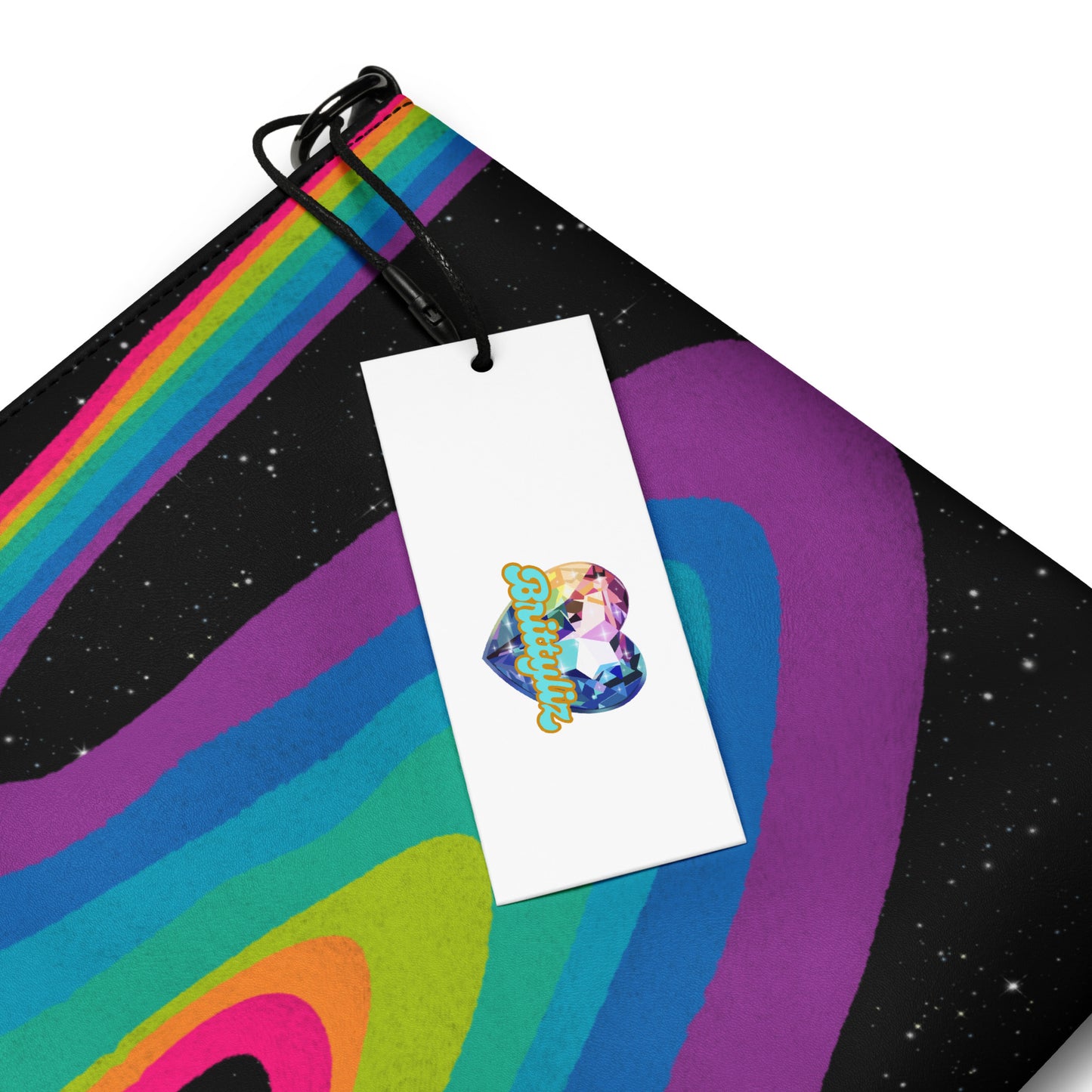 Cosmic Rainbow Drift Crossbody Bag in black - hand-drawn swirling rainbow art on a starry galaxy background, faux leather with wrist strap, close-up view.