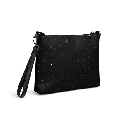Cosmic Rainbow Drift Crossbody Bag in black - hand-drawn swirling rainbow art on a starry galaxy background, faux leather with wrist strap, back view.