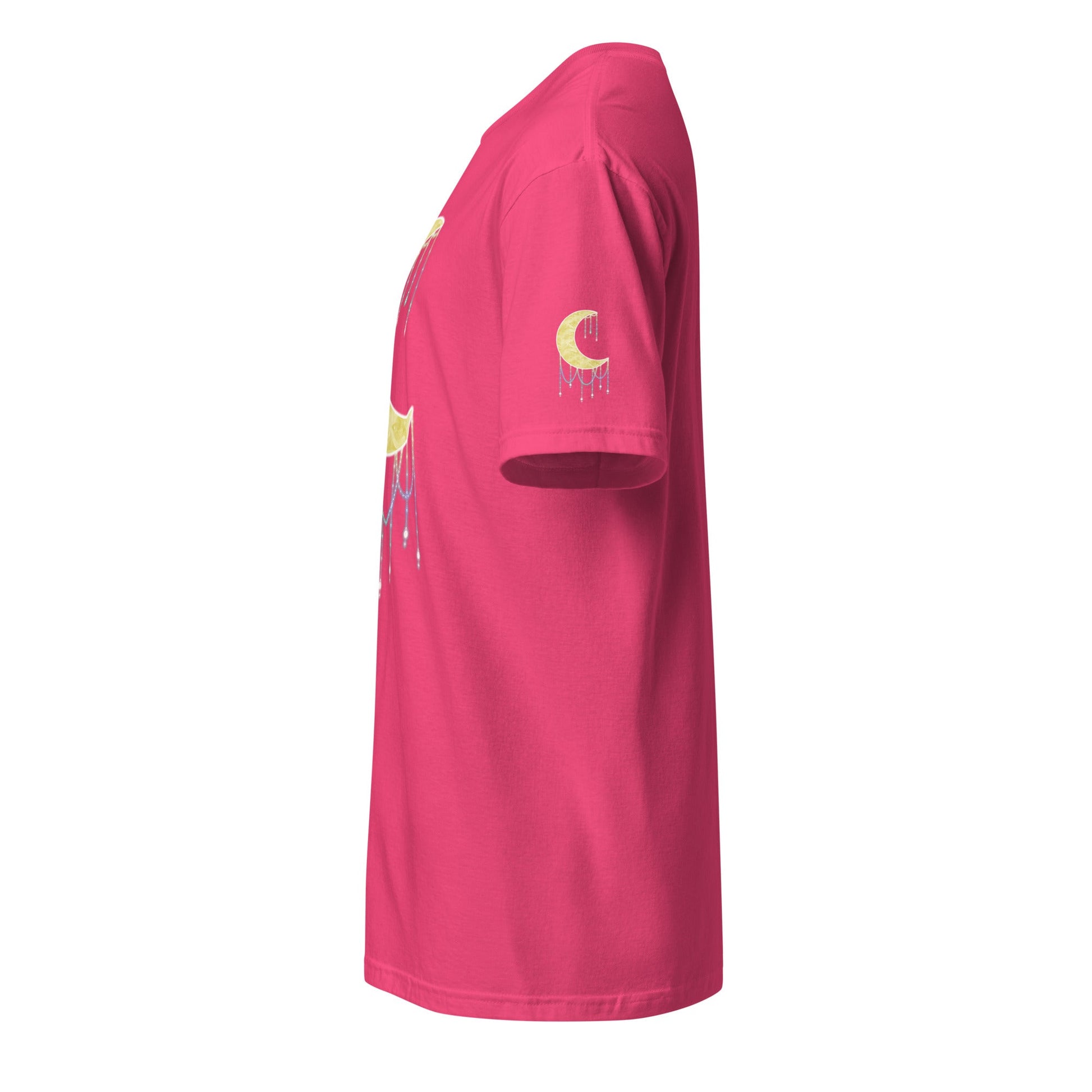 A bright pink t-shirt viewed from a side profile view, featuring a gold crescent moon graphic with a dripping beads effect on the left sleeve and a matching graphic on the side.