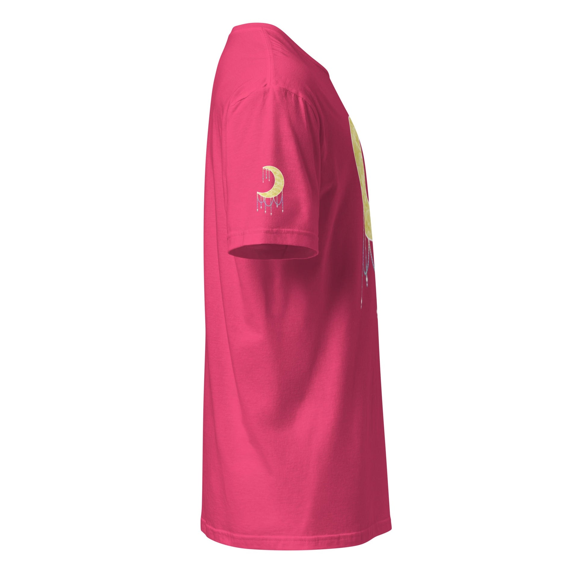 A bright pink t-shirt viewed from a side profile view, featuring a gold crescent moon graphic with a dripping beads effect on the left sleeve and a matching graphic on the side.