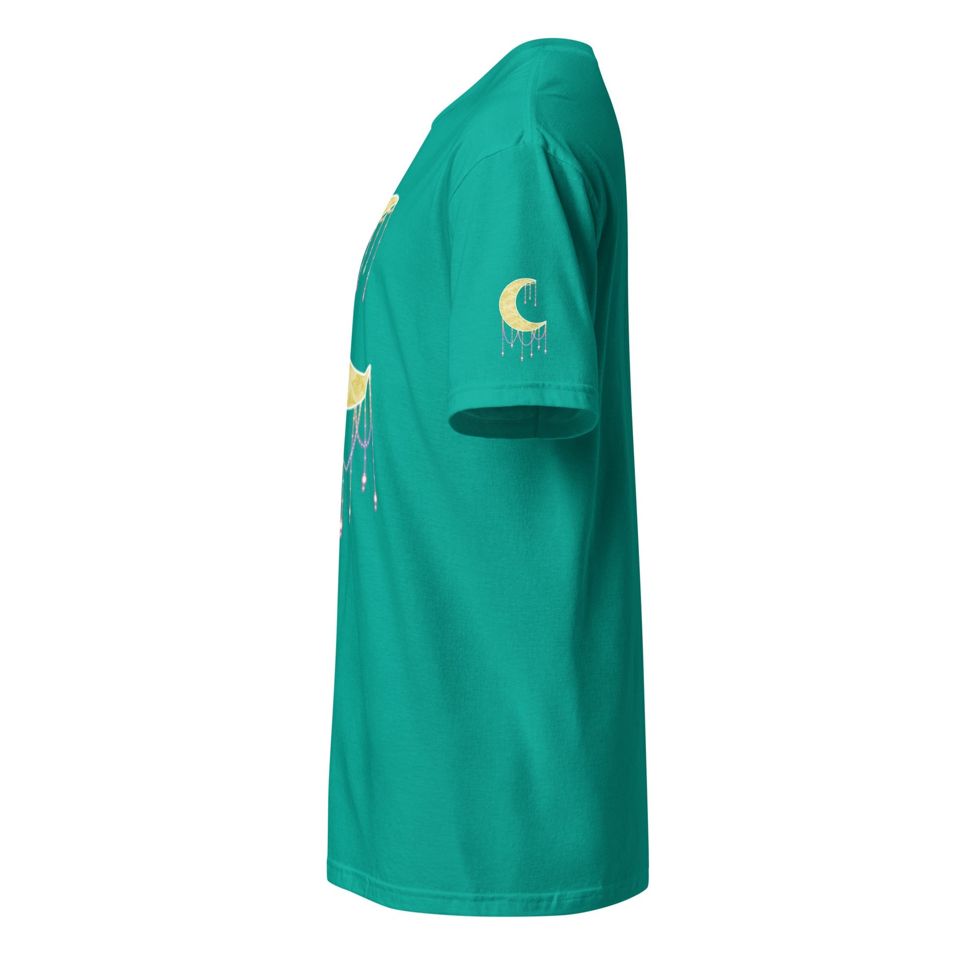 A teal blue t-shirt viewed from a side profile view, featuring a gold crescent moon graphic with a dripping beads effect on the left sleeve and a matching graphic on the side.