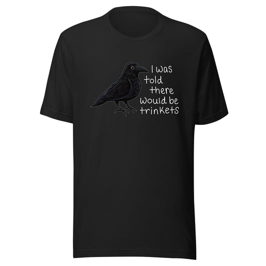 Trinkets unisex t-shirt with original hand-drawn crow art by Brittyliz, shown on a ghost style mockup model